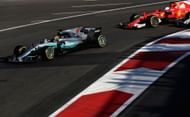 Lewis Hamilton of Great Britain and Sebastian Vettel of Germany drive the (5) Scuderia Ferrari. Source: Getty